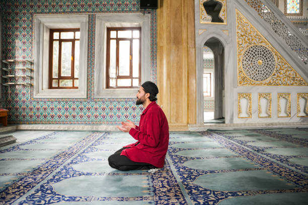 istock Muslim young man praying in the mosque 2088945050