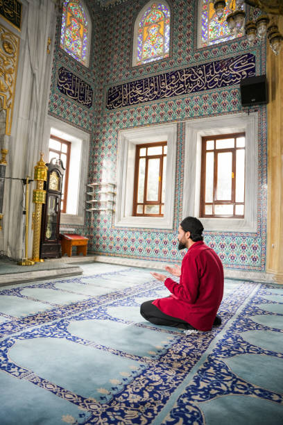 istock Muslim young man praying in the mosque 2088945052