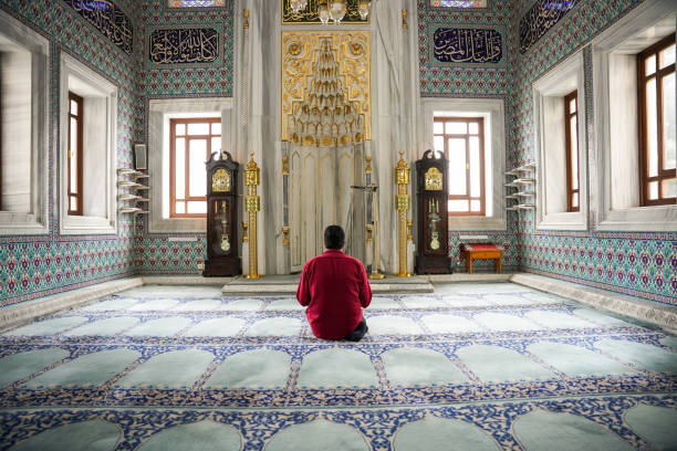 istock Muslim young man praying in the mosque 2088945058