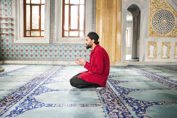 istock Muslim young man praying in the mosque 2088949294