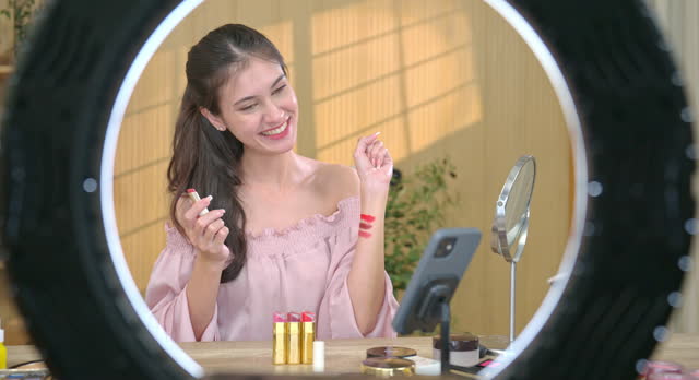 Beauty Vlogger Reviewing Lipstick Shades on Camera