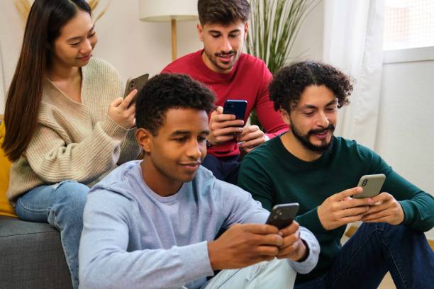 istock Multiracial group of friends using the phone at home. 2088969609