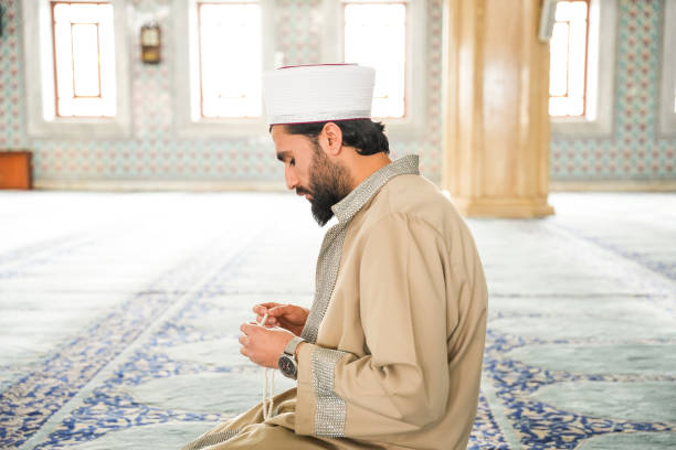 istock Mosque imam prays rosary after prayer 2088990870