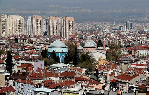 Bursa, Turkey - April 14, 2021: Photo with a panoramic view of the city with many mosques and a Green Tomb