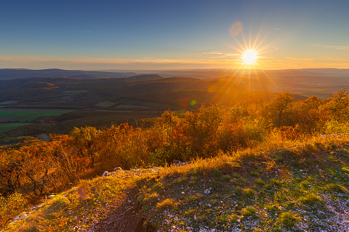 Countryside seen from one of the peaks of Pilis mountains. Panoramic view of countryside at sunset