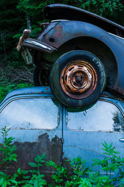 Nelson, Nevada - April 15, 2024: Close-up view of two small weathered vintage beetle cars in Nelson Ghost Town