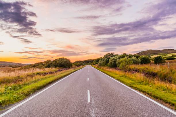 Summer Landscape in Scotland, UK Summer Landscape in Scotland, UK car-on-city-road-side-view stock pictures, royalty-free photos & images