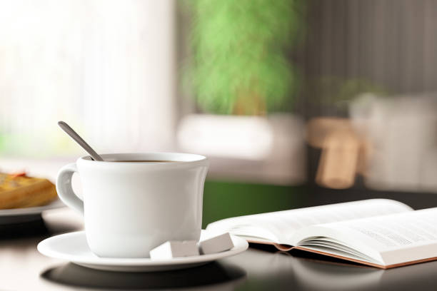 istock An Open Book and a Cup of Coffee on Table 2089126617