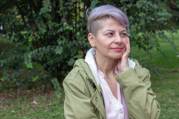 istock Middle aged woman posing in a public park 2089179959