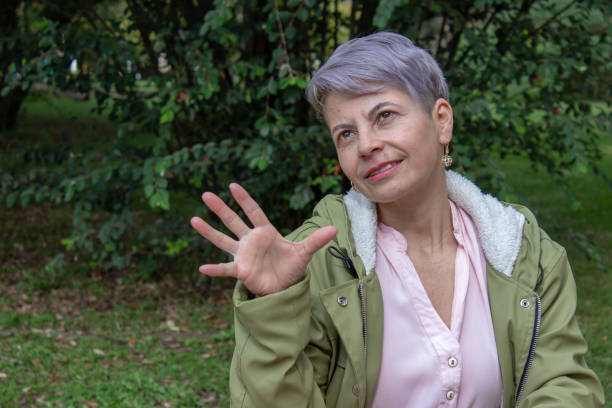 istock Middle aged woman posing in a public park 2089179974