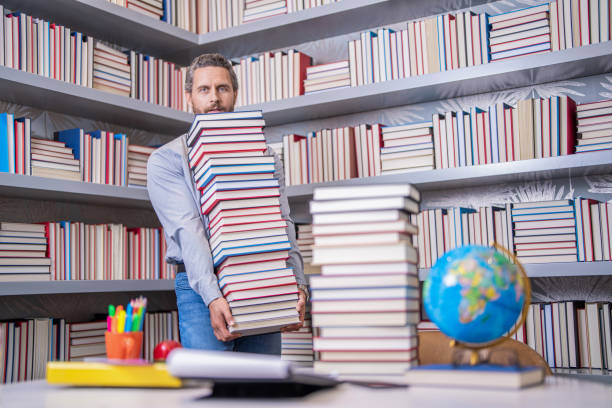 istock knowledge day. Expand your horizons with reading. man get university education. school education with man teacher. education and knowledge. back to school. teachers day. teachers education in school 2089196174