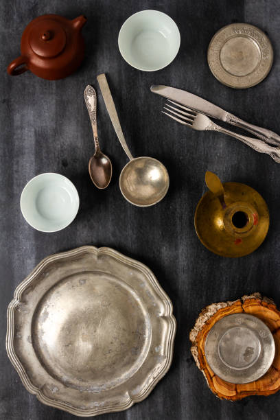 istock Various antique vintage dishes on black background 2089199823
