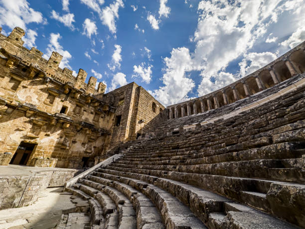 partially restored roman theater in the ancient settlement of aspendos, turkey - roman antalya turkey restoring stock-fotos und bilder