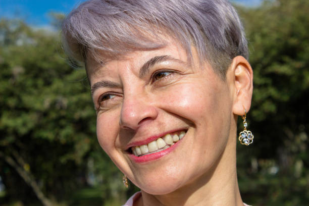 istock Middle aged woman posing in a public park 2089205060