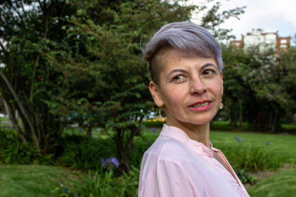 istock Middle aged woman posing in a public park 2089218126