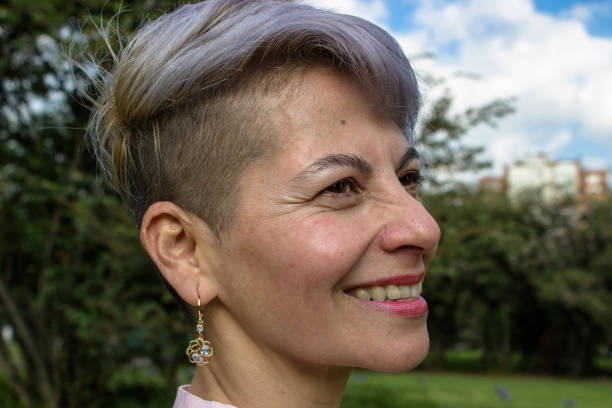 istock Middle aged woman posing in a public park 2089219168