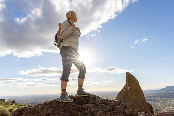 istock Hiker enjoys view from top of rock bluff 2089223379