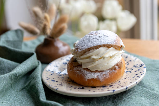 istock Typical Swedish semla with sweet cream on te blue textile 2089233773
