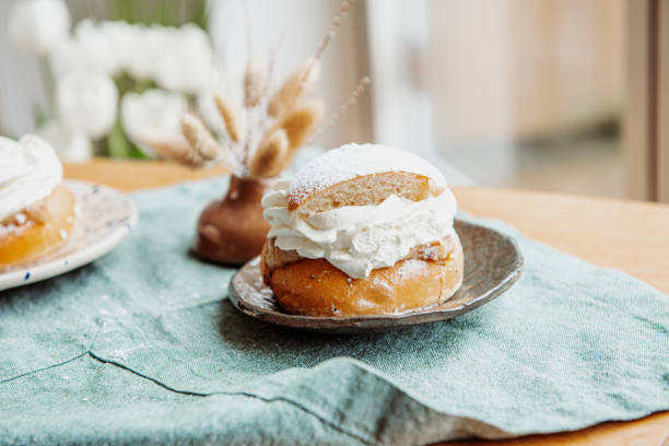 istock Typical Swedish semla with sweet cream on te blue textile 2089234289