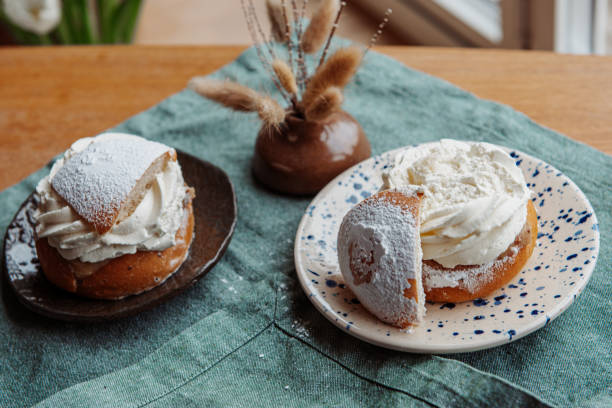 istock Typical Swedish semla with sweet cream on te blue textile 2089234291