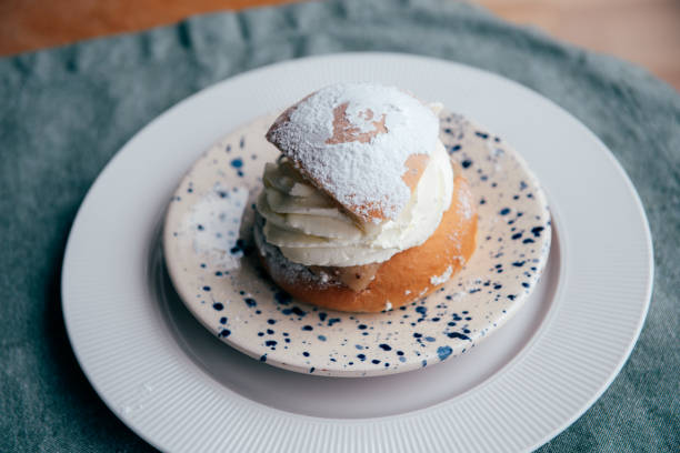 istock Typical Swedish semla with sweet cream on te blue textile 2089234294