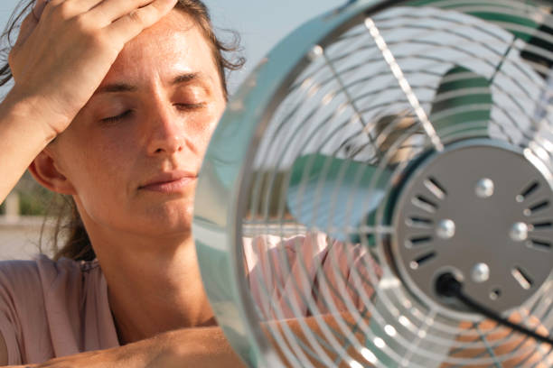 istock Woman with Fan 2089234809