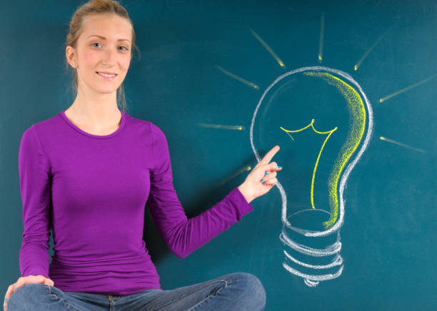 istock Young woman and light bulb big idea 2089251299