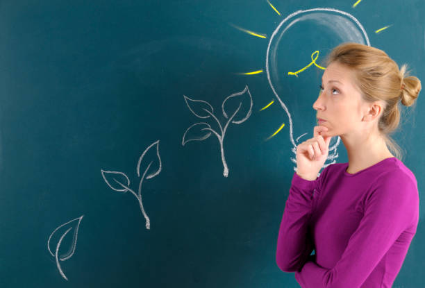istock Young woman and light bulb big idea 2089251304