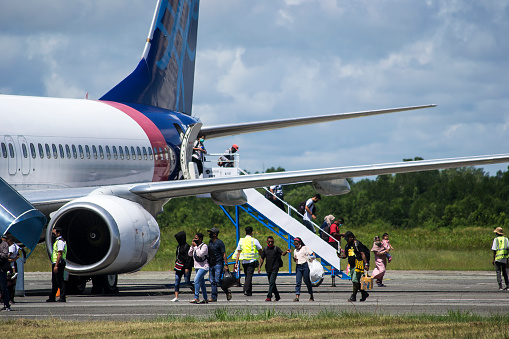 An Air Transat airplane parking at Pearson International Airport - the primary international airport serving Toronto, Golden Horseshoe.