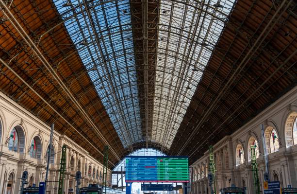 Budapest, Hungary - January 28, 2024: Keleti train station. Information table on the foreground.