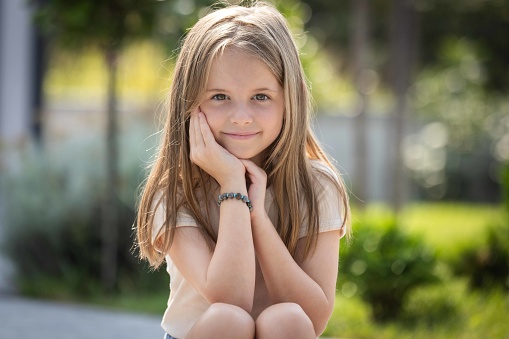 Outdoor portrait of a Little girl smiling
