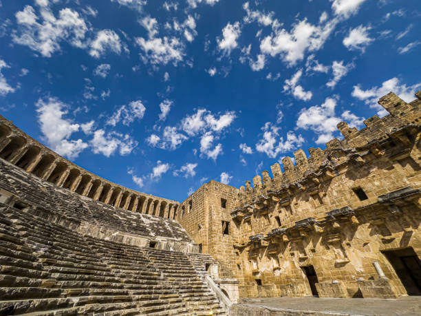 partially restored roman theater in the ancient settlement of aspendos, turkey - roman antalya turkey restoring stock-fotos und bilder