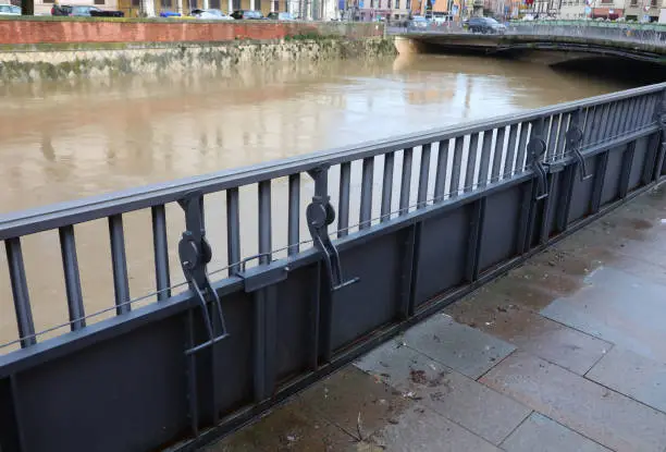 long metallic bulkheads to protect Vicenza City in northern Italy during the flood in winter