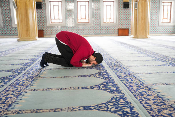 istock Muslim young man praying in the mosque 2089356302