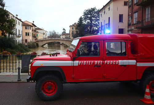 Vicenza, VI, Italy - January 28, 2024: Italian van of italian firfighter called VIGILI DEL FUOCO while raining during flood