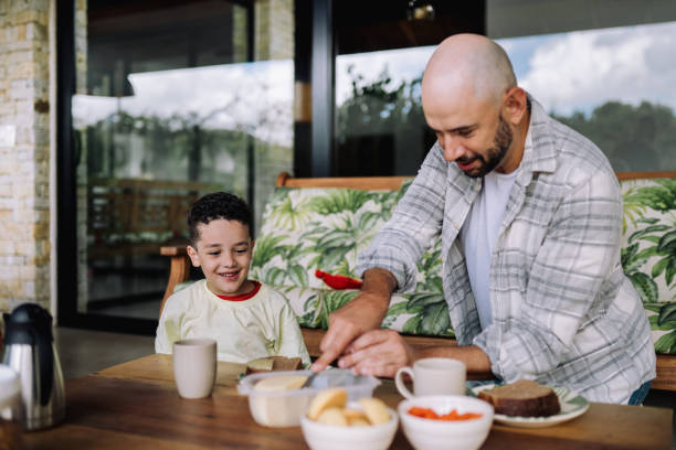 istock Son and dad having a breakfast outside in the patio 2089389866