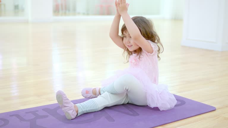 Little Girl in Leotards or Tutu Dress Practise Stretching at Ballet Class Studio