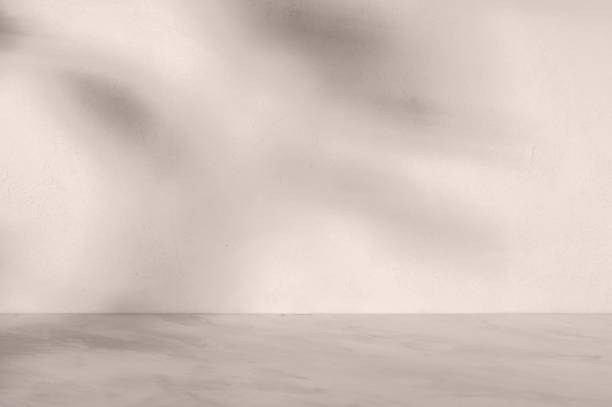 istock Neutral taupe beige marble empty podium table and textured concrete wall background with abstract natural aesthetic sunlight shadows, minimal mockup for beauty product placement 2089400522
