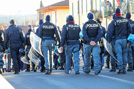 Vicenza, VI, Italy - January 20, 2024: Italian police in riot gear during the protest demonstration with helmets