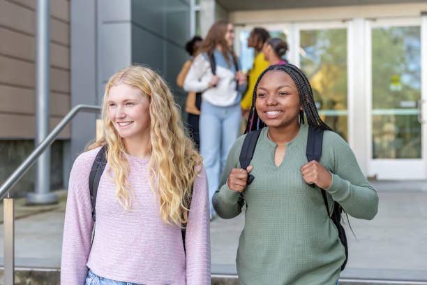 istock Two female college students on campus with backpacks 2089487679
