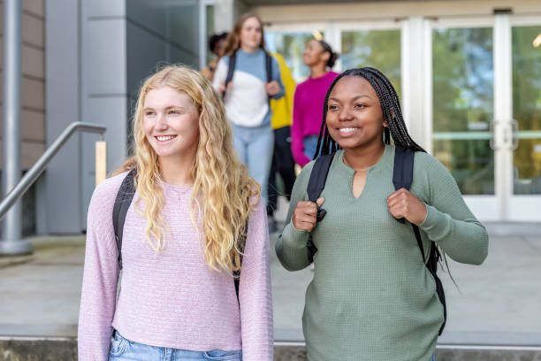istock Two female college students on campus with backpacks 2089488189