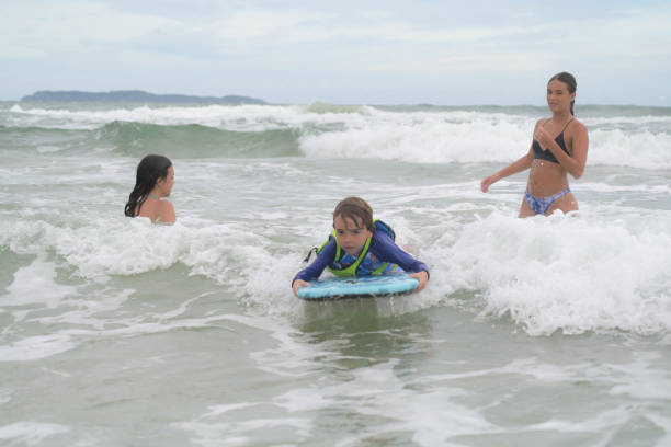 istock brothers in the sea playing with the waves 2089533902