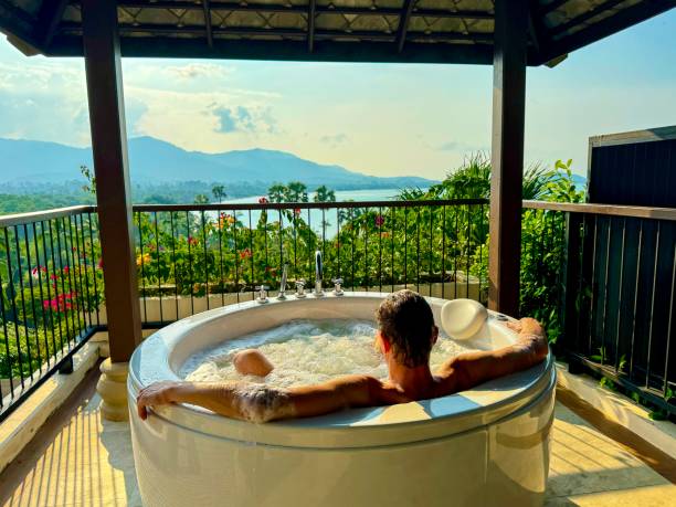 istock Man relaxing in a hot tub on a balcony 2089554090