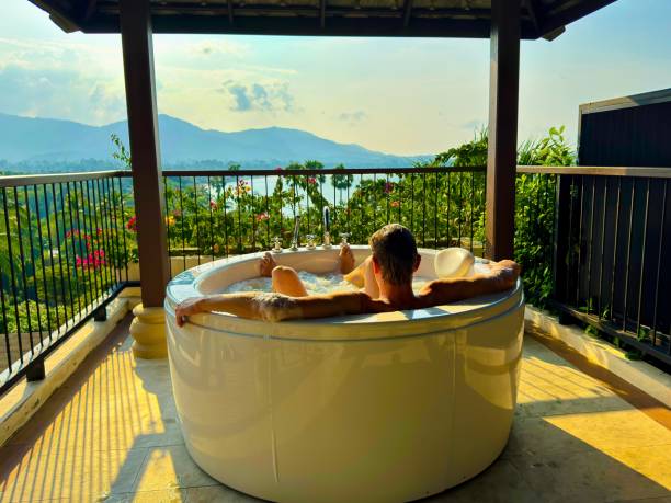 istock Man enjoying hot tub on a balcony 2089554467