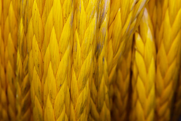 Mooring ship rope wound on a winch, close-up.