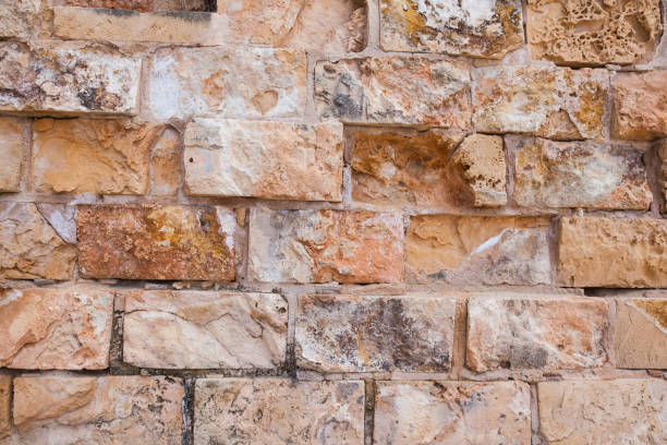 istock Stone wall made of natural seashell stone. 2089565895