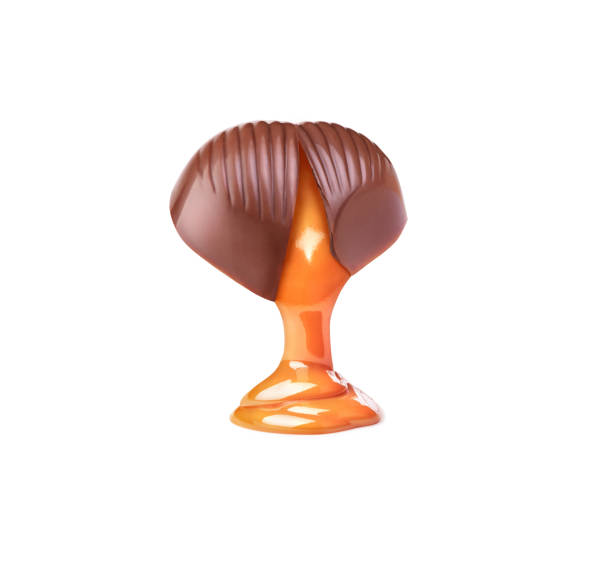 istock chocolate candy with caramel splash on white background5 2089566405