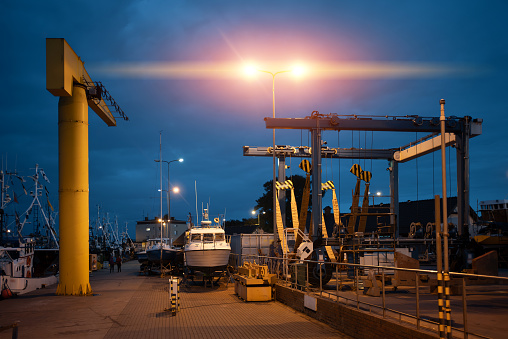 small port with crane and ships at Polish town Jastarnia, Hel peninsula, Poland. High quality photo