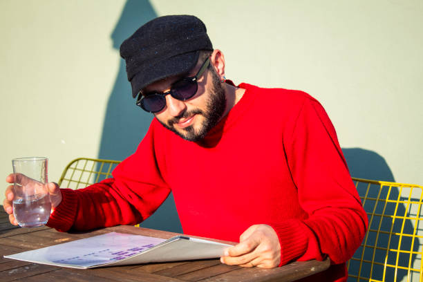 A man enjoying reading on the balcony