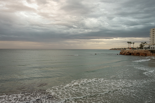 Stormy sky on La Zenia beach in Alicante. Spain.